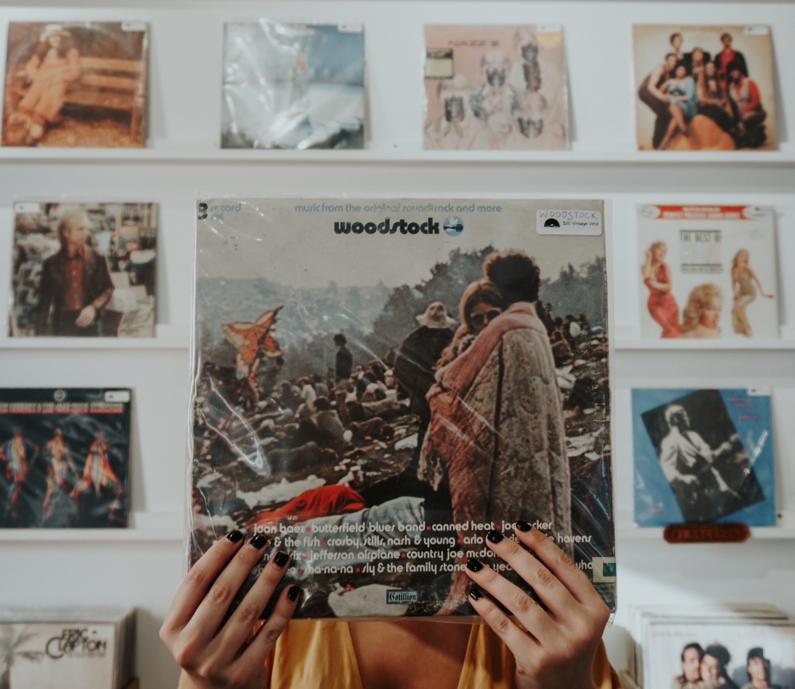 Hands on a Woodstock vinyl album