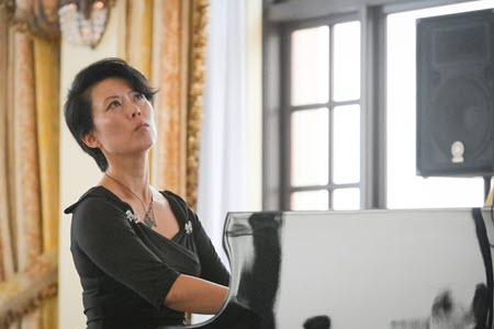 Makiko Hirata plays piano using the arts for climate action.