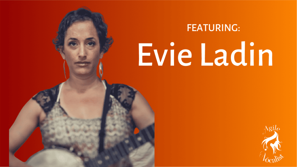 Woman facing the camera with short, dark hair holding a banjo and a serious expression on her face. Text: Featuring Evie Ladin